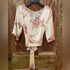 Ivory floral satin zip-back blouse.